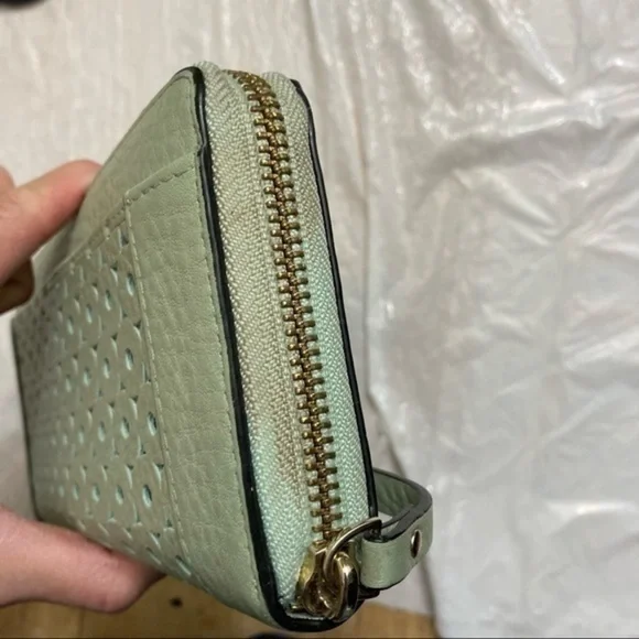 Kate spade green perforate eyelet lace leather zipper clutch wallet